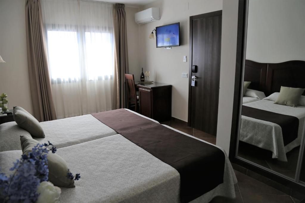A bed or beds in a room at Arcos de Montemar