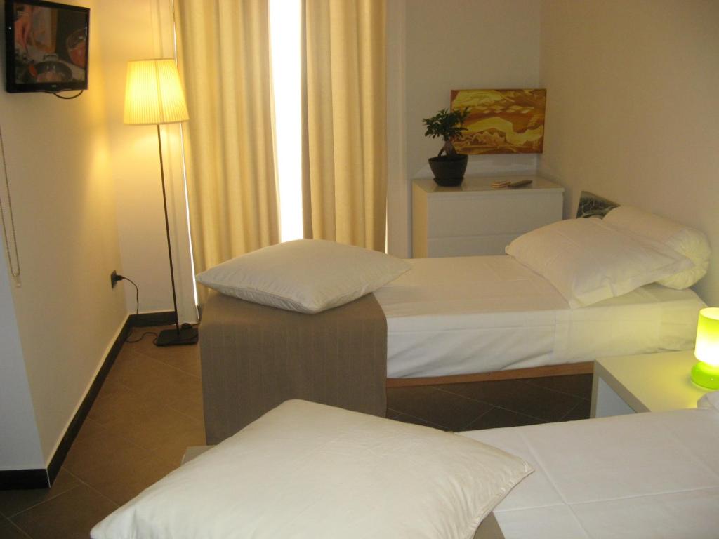 Postel nebo postele na pokoji v ubytování iBed Napoli B&B