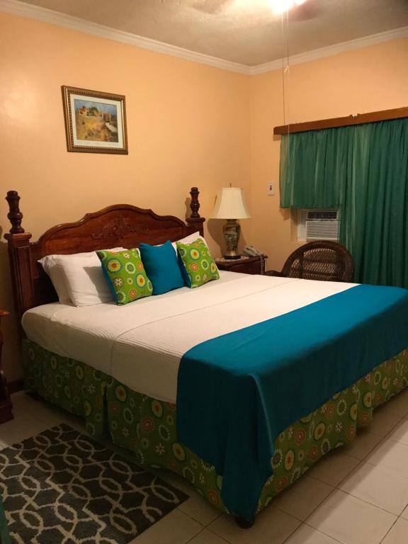 Postel nebo postele na pokoji v ubytování Rayon Hotel