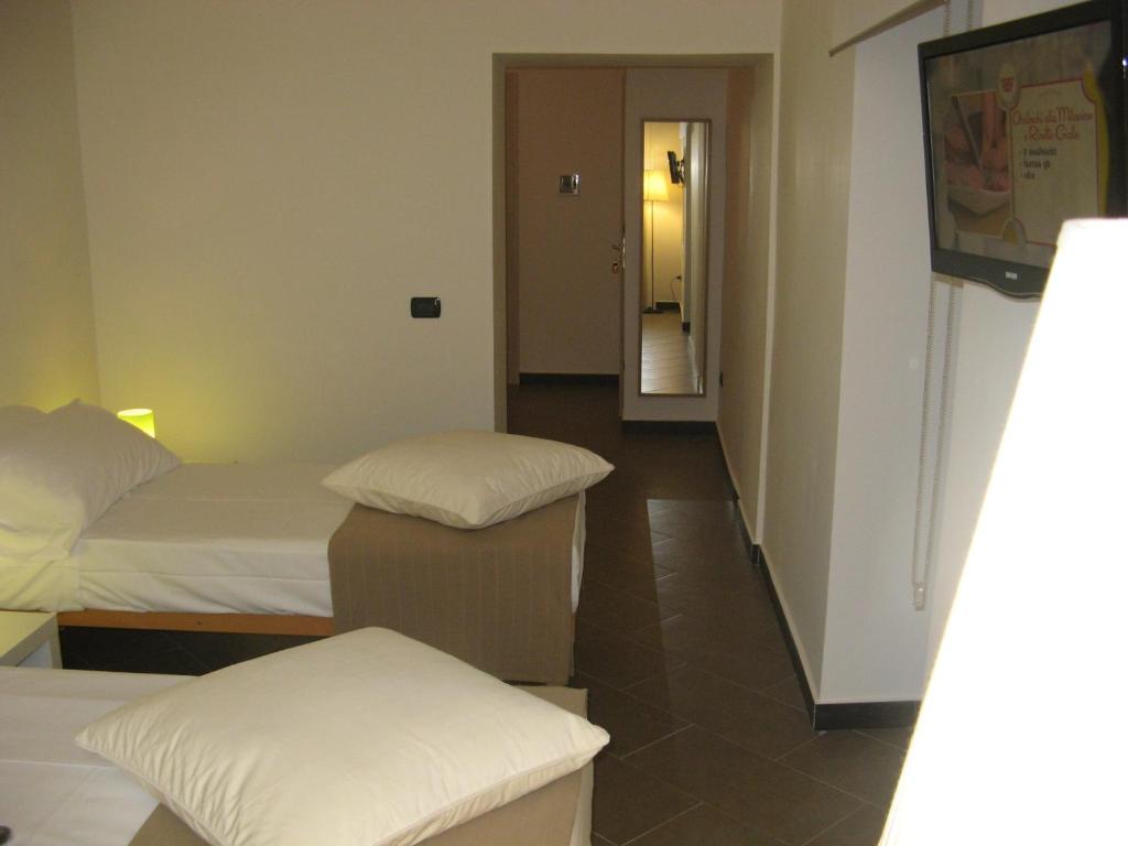 Postel nebo postele na pokoji v ubytování iBed Napoli B&B