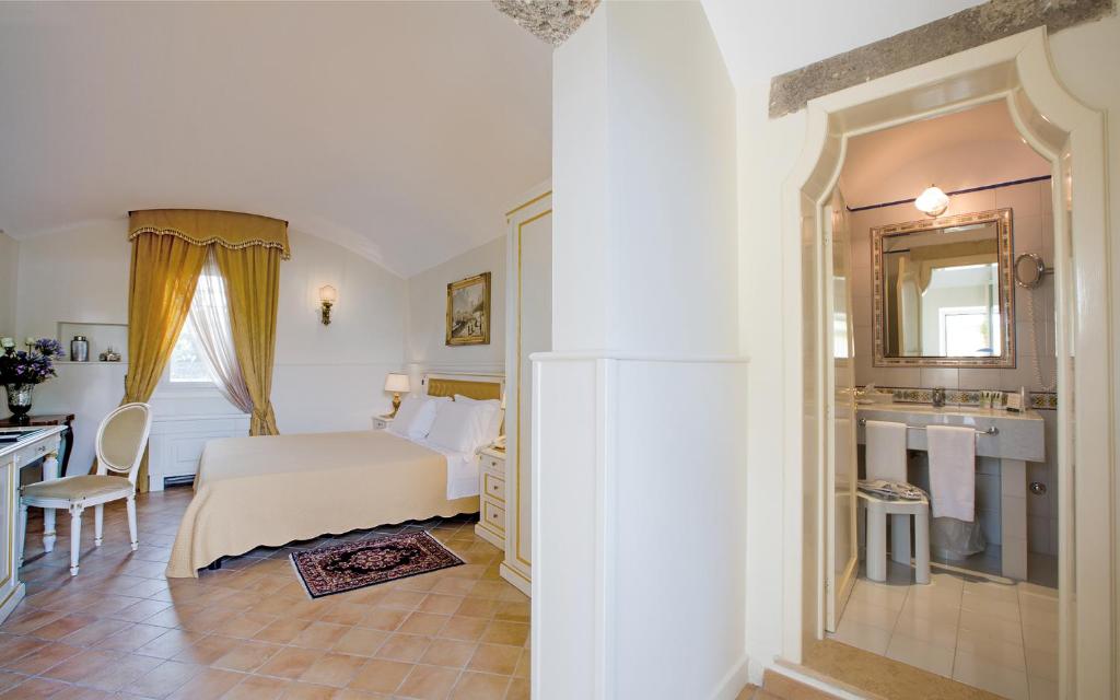 Postel nebo postele na pokoji v ubytování Sangiorgio Resort & Spa