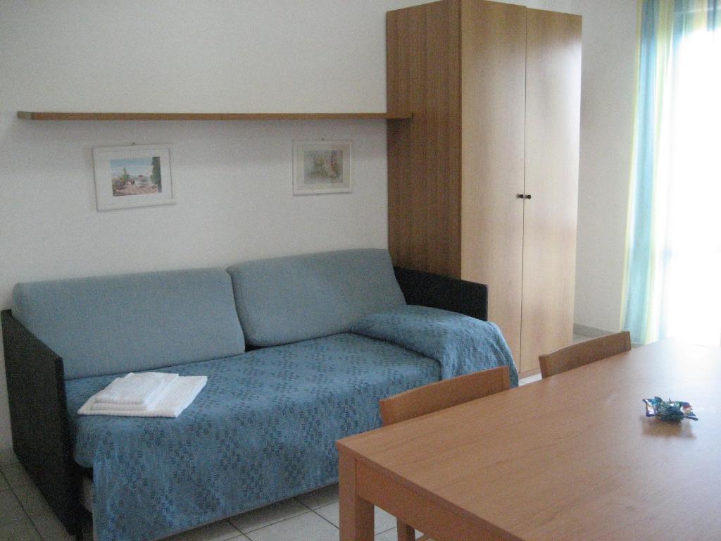 a living room with a couch and a table at Residence Club Barbara in Ostuni