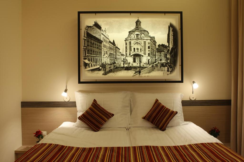 Postel nebo postele na pokoji v ubytování Lion Prémium Hotel