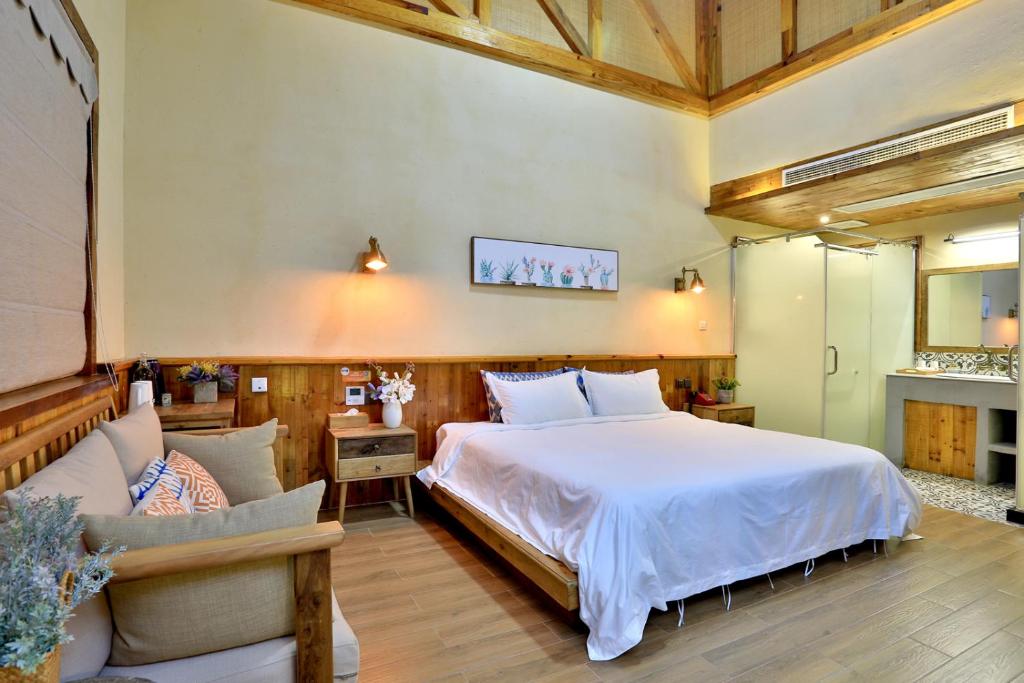 Postel nebo postele na pokoji v ubytování Youxiake Canal Hotel Hangzhou