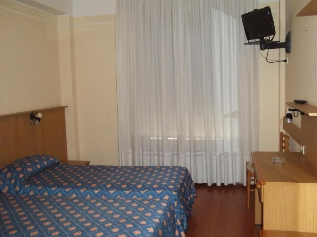 Postel nebo postele na pokoji v ubytování Hotel Palladio