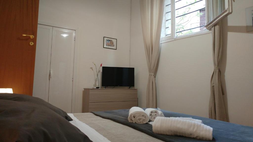 Llit o llits en una habitació de Dreaming Navona Rooms