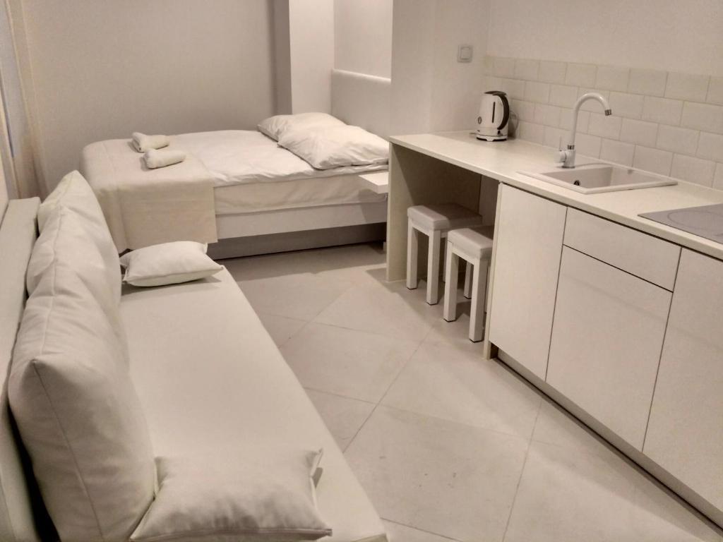 Postel nebo postele na pokoji v ubytování Mirror Apartments