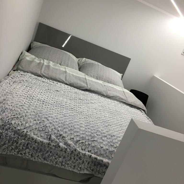 Posteľ alebo postele v izbe v ubytovaní Apartament MnW