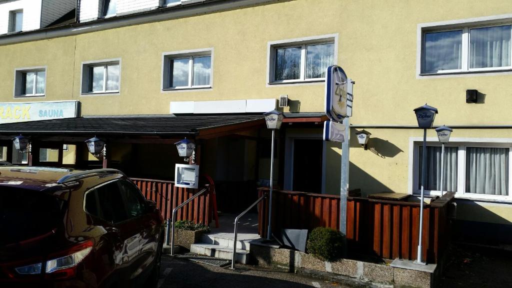 a building with a street sign in front of it at Makss in Wels