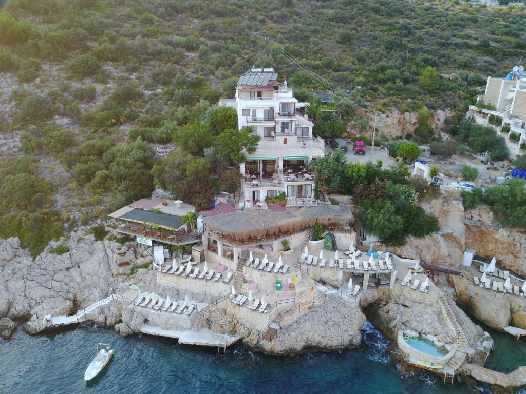 an aerial view of a large house on a cliff at Caretta Hotel in Kalkan