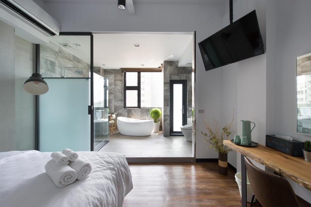 Voodi või voodid majutusasutuse OX Suites toas