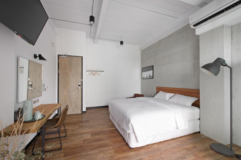 Voodi või voodid majutusasutuse OX Suites toas