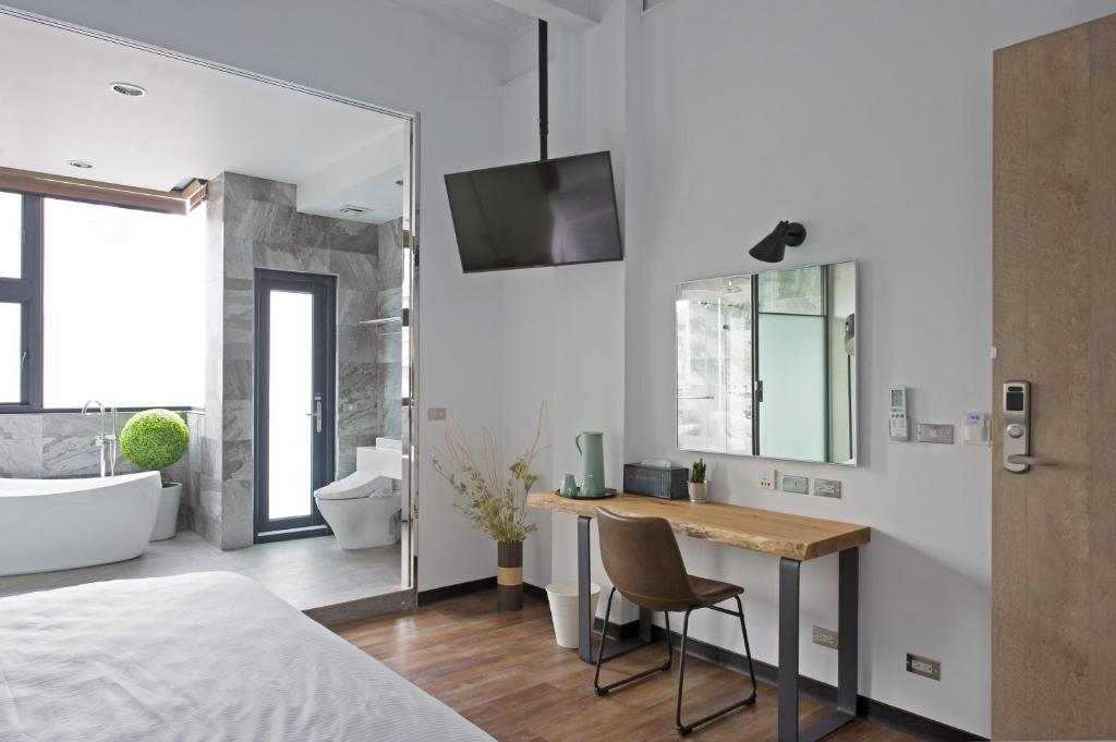 Voodi või voodid majutusasutuse OX Suites toas