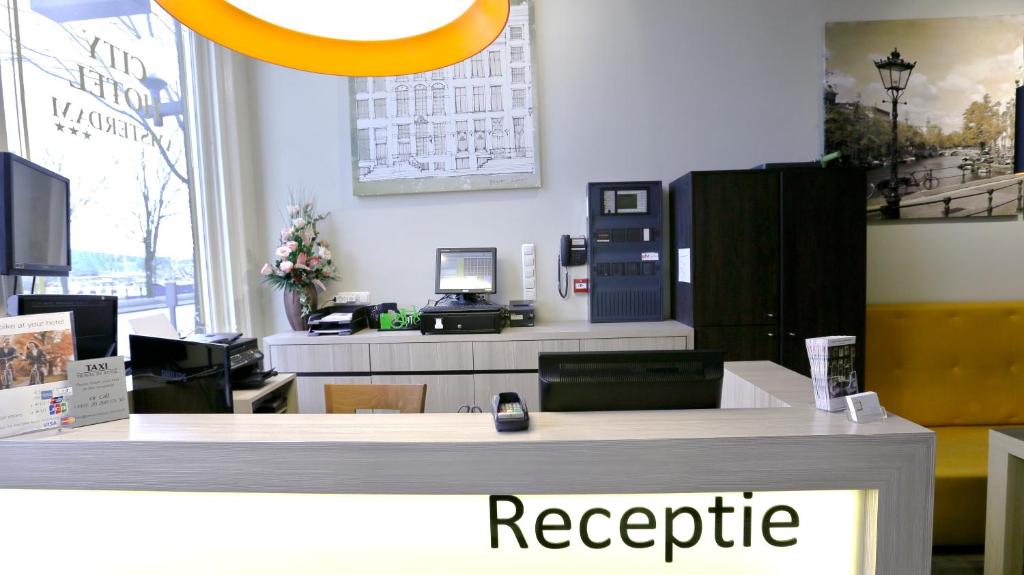 an office with a reception desk with a register at City Hotel Amsterdam in Amsterdam