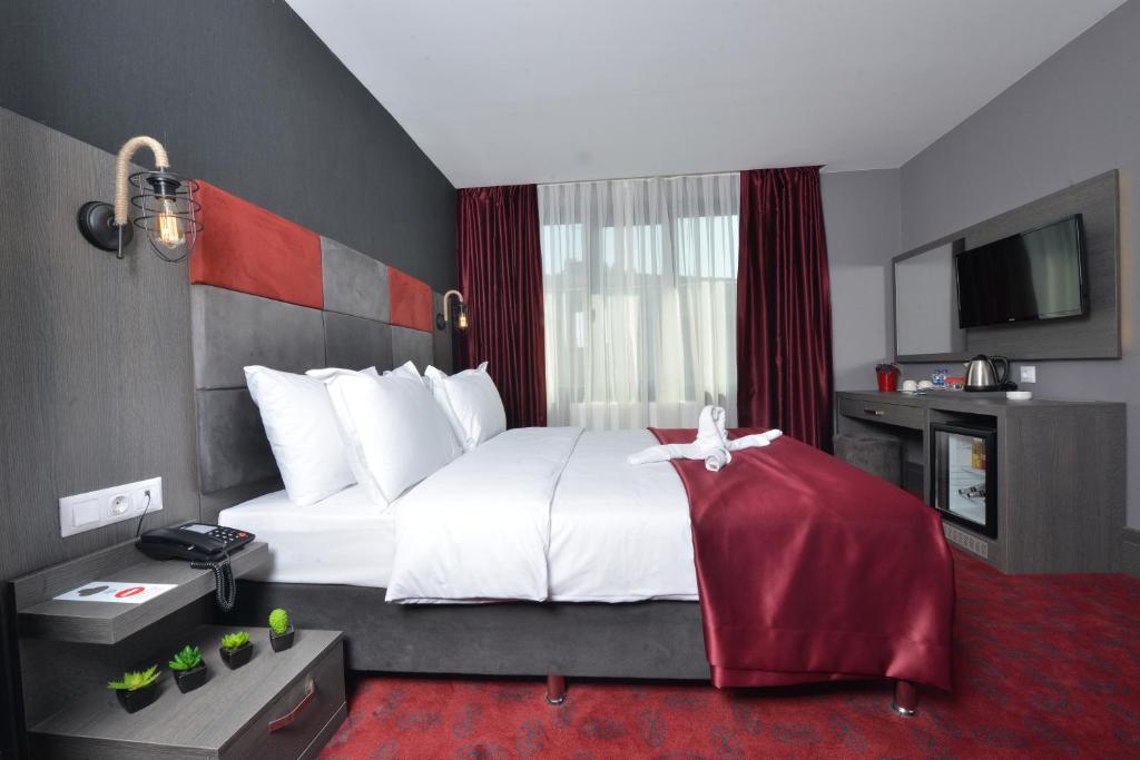 Postel nebo postele na pokoji v ubytování A11 Hotel