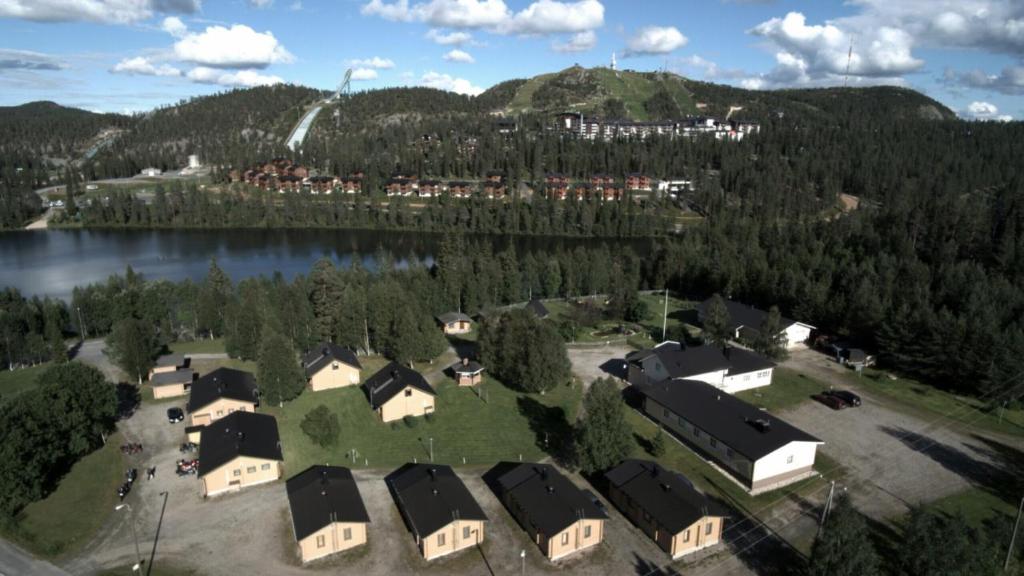 an aerial view of a house next to a lake at Matkailumaja Heikkala Cottages in Ruka