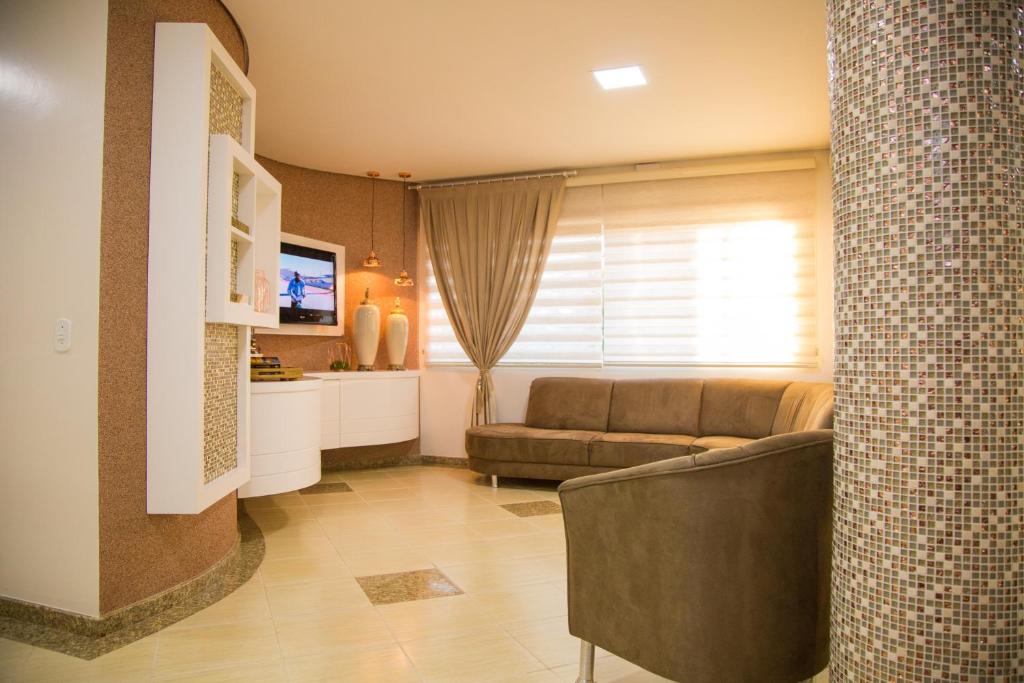 TV a/nebo společenská místnost v ubytování Dois Vizinhos Palace Hotel