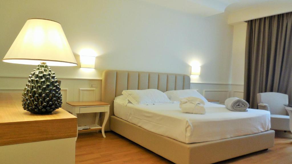 Postel nebo postele na pokoji v ubytování Hotel Marechiaro
