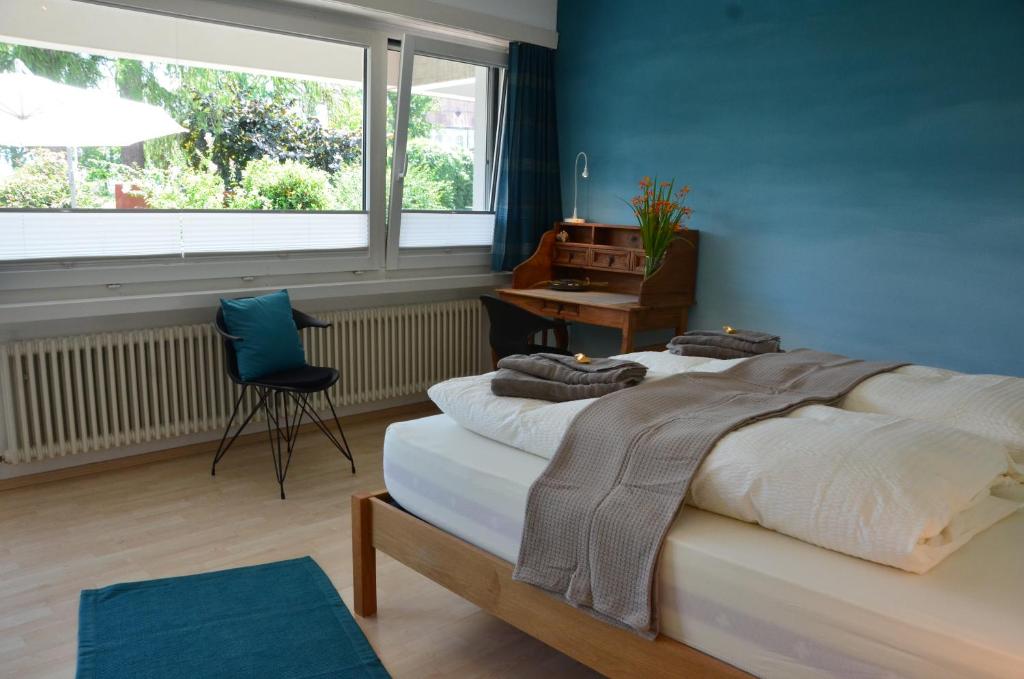 Postel nebo postele na pokoji v ubytování Lakelodge Romanshorn