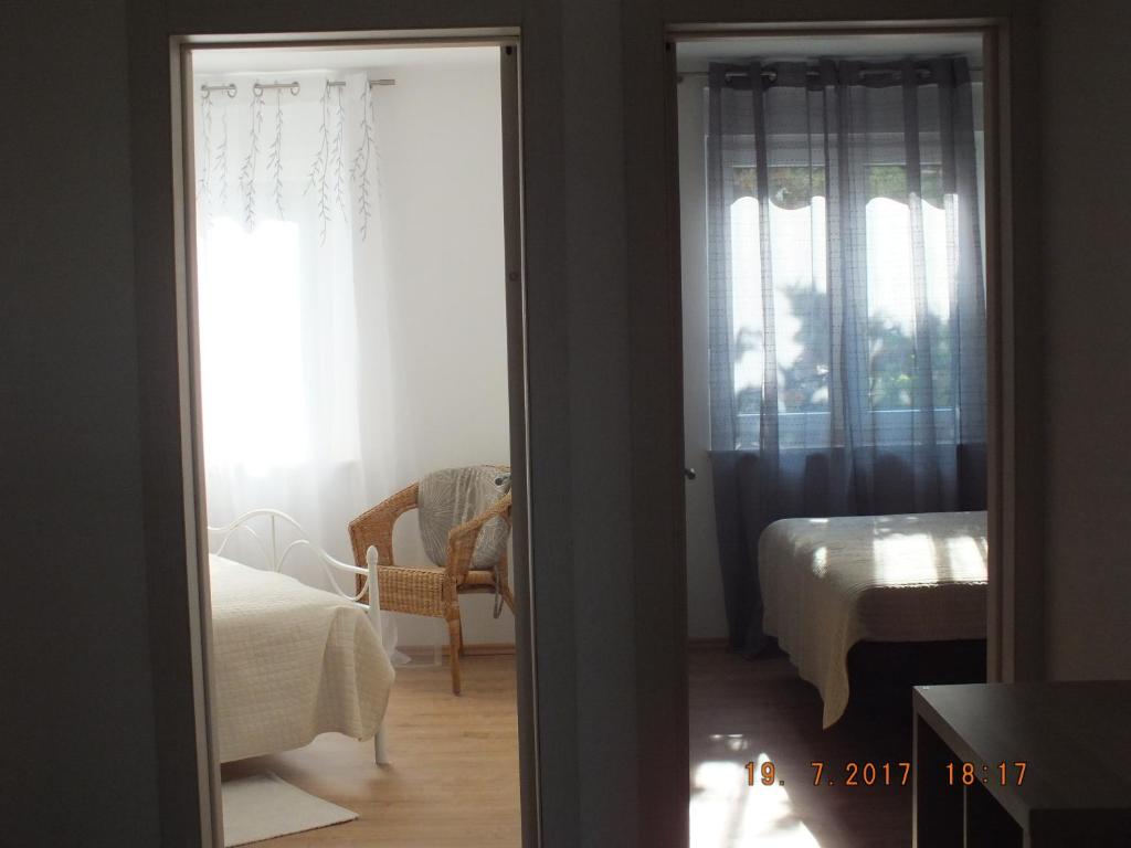 Łóżko lub łóżka w pokoju w obiekcie Apartments Amore