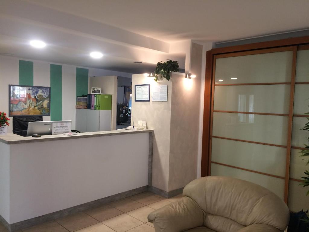 Televízia a/alebo spoločenská miestnosť v ubytovaní Residence Abamar