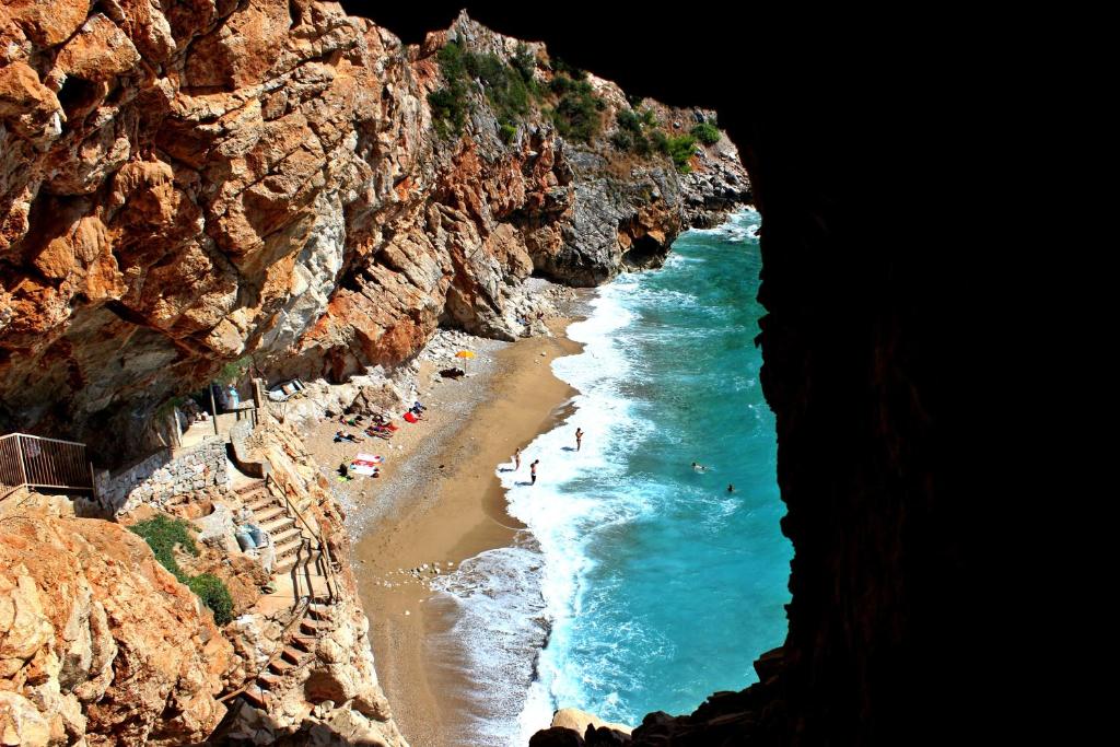 an aerial view of a beach with people on it at Friendly Apartments in Gruda