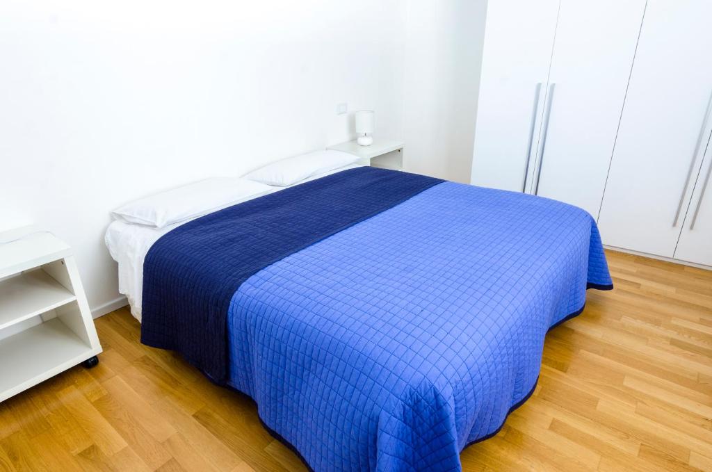 Łóżko lub łóżka w pokoju w obiekcie Appartamenti Segantini