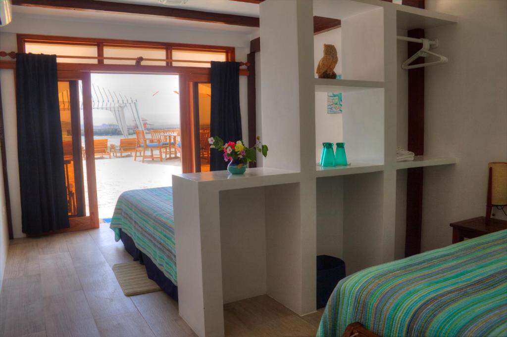 Postel nebo postele na pokoji v ubytování The Isabela Beach House