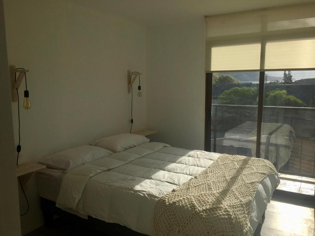 Postel nebo postele na pokoji v ubytování Hostal CKAIR