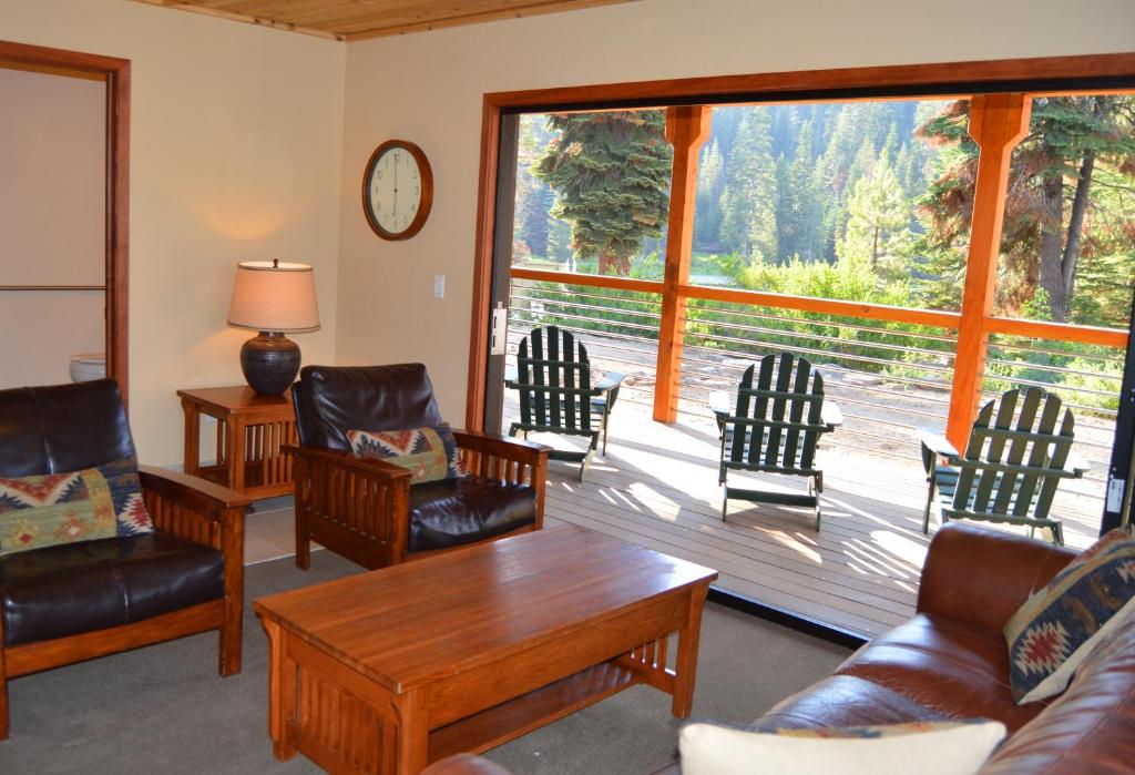 a living room filled with furniture and a window at Montecito Sequoia Lodge in Sequoia