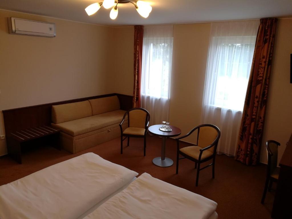 Postel nebo postele na pokoji v ubytování Penzion Siesta