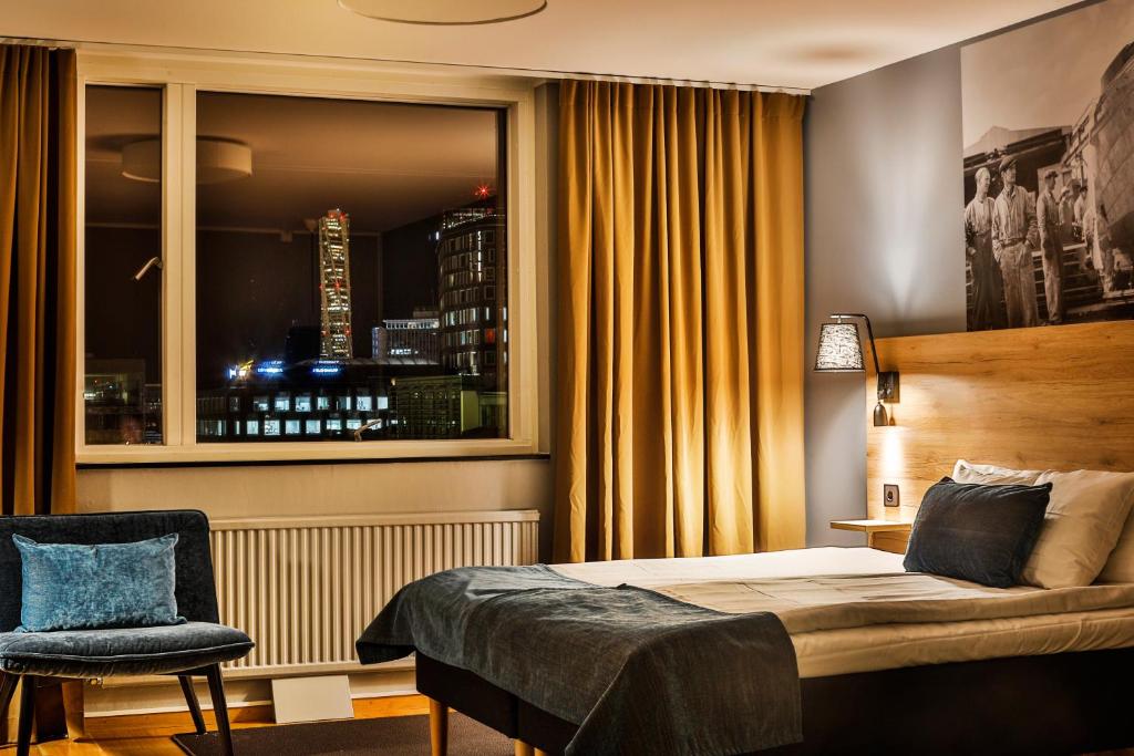 Postel nebo postele na pokoji v ubytování First Hotel Jörgen Kock