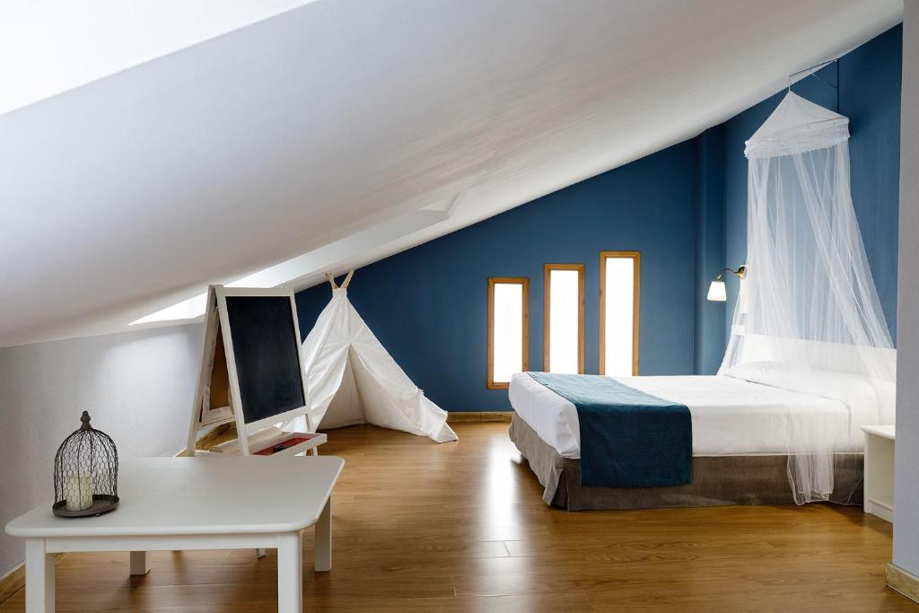 Postel nebo postele na pokoji v ubytování Hotel Jakue