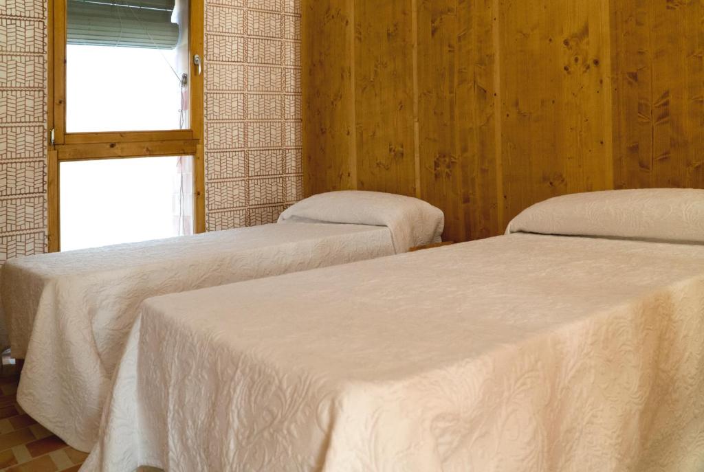 Postel nebo postele na pokoji v ubytování Moll Petit Apartments - Turismo de Interior