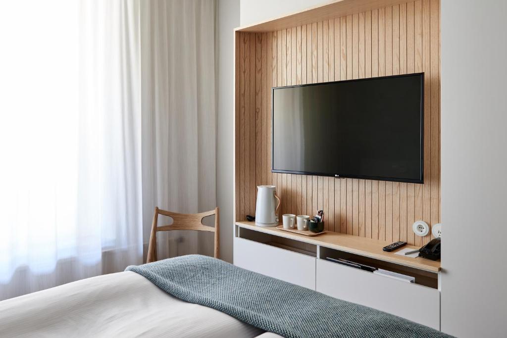 Postel nebo postele na pokoji v ubytování Nordic Light Hotel