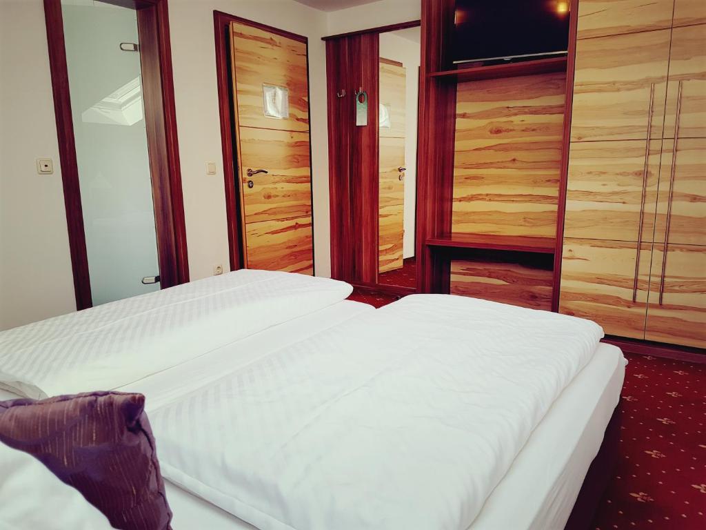 Postel nebo postele na pokoji v ubytování Hotel Spechtshaardt