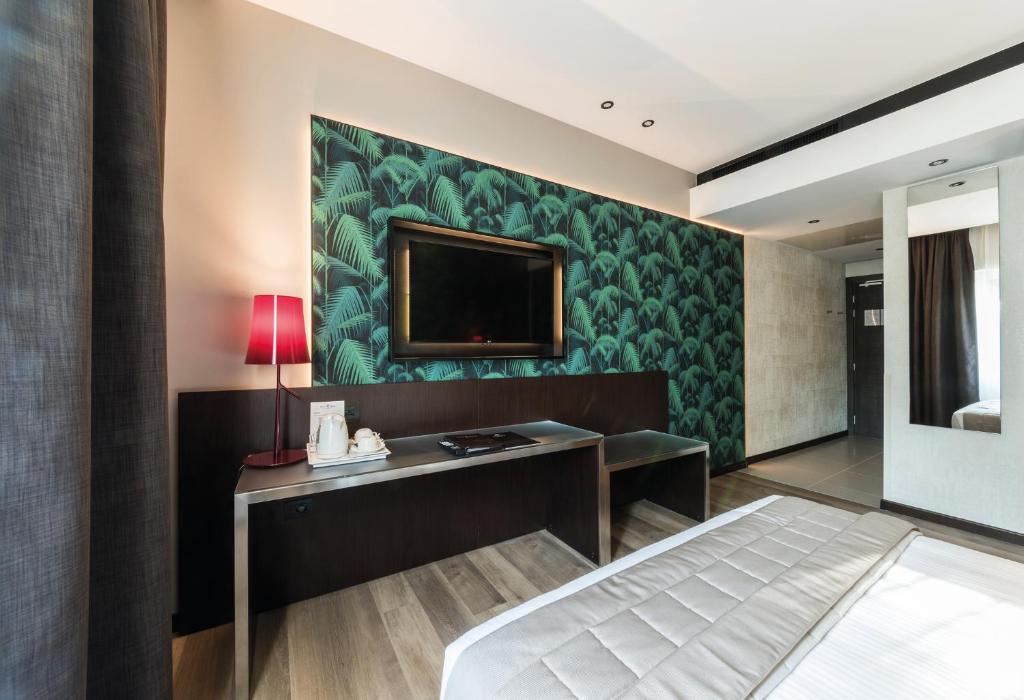 Телевізор і / або розважальний центр в Hotel Manin