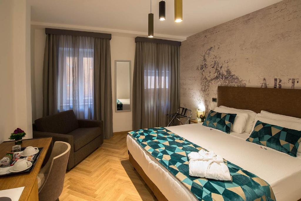 Postel nebo postele na pokoji v ubytování Navona Essence Hotel