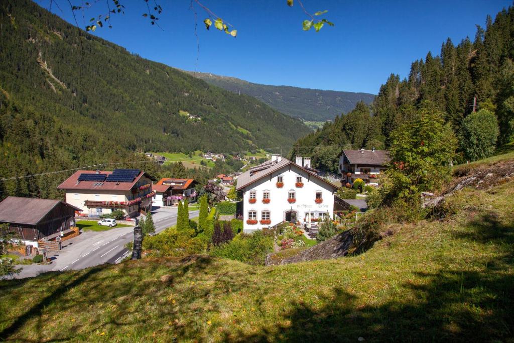 a small village in a valley with a mountain at Apartments HAUS SCHÖN - Preise inclusive Pitztal Sommer Card in Jerzens
