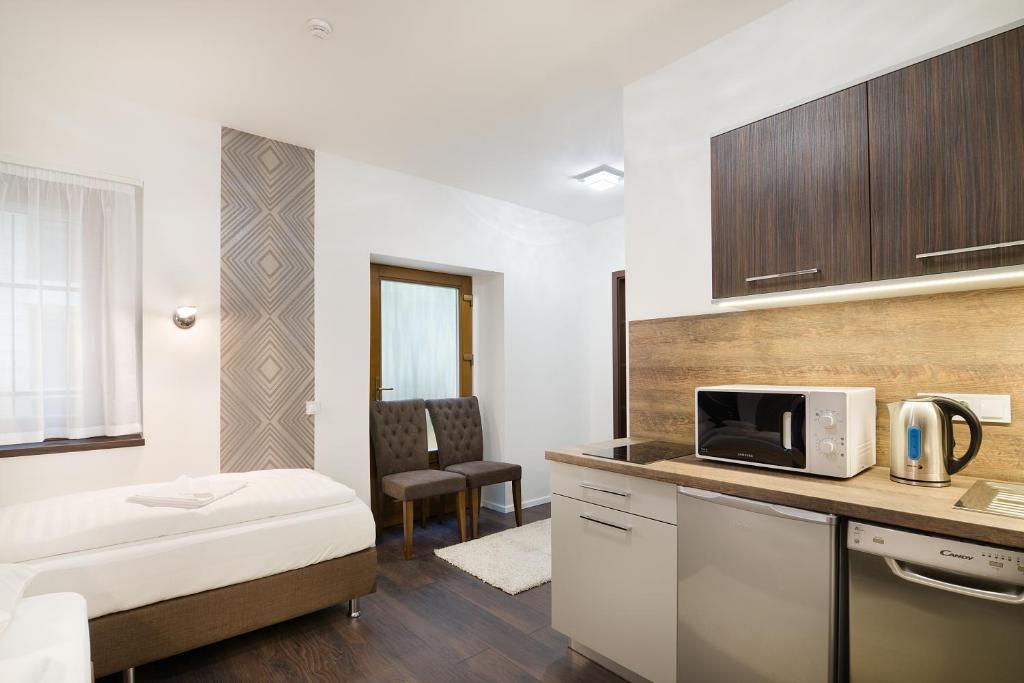 Posteľ alebo postele v izbe v ubytovaní Paulay Downtown Apartments