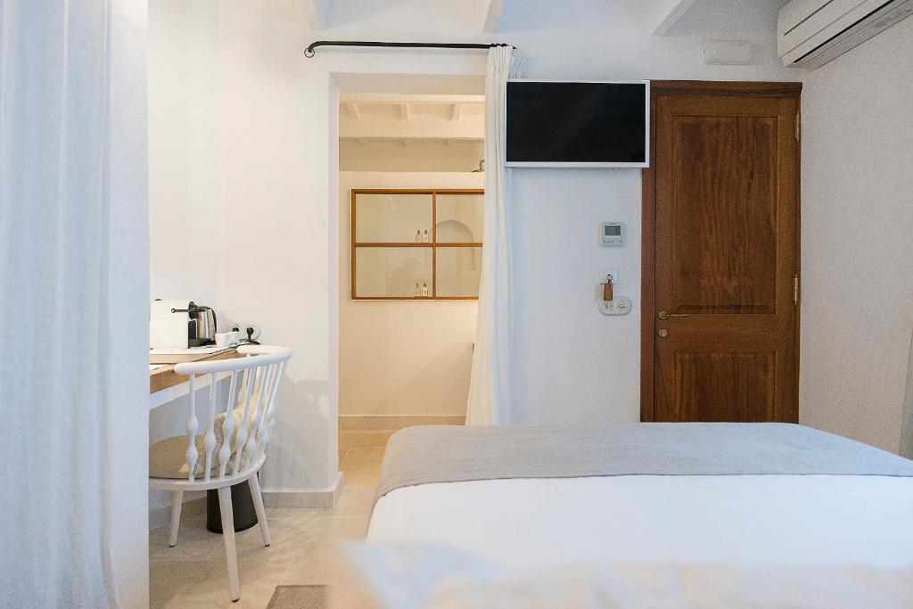 Posteľ alebo postele v izbe v ubytovaní S'Hotelet d'es Born - Suites & SPA