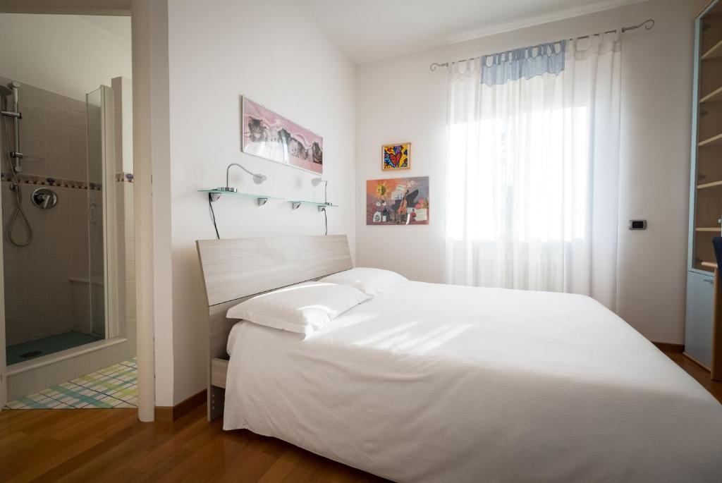 Posteľ alebo postele v izbe v ubytovaní L'ippocampo Guest House