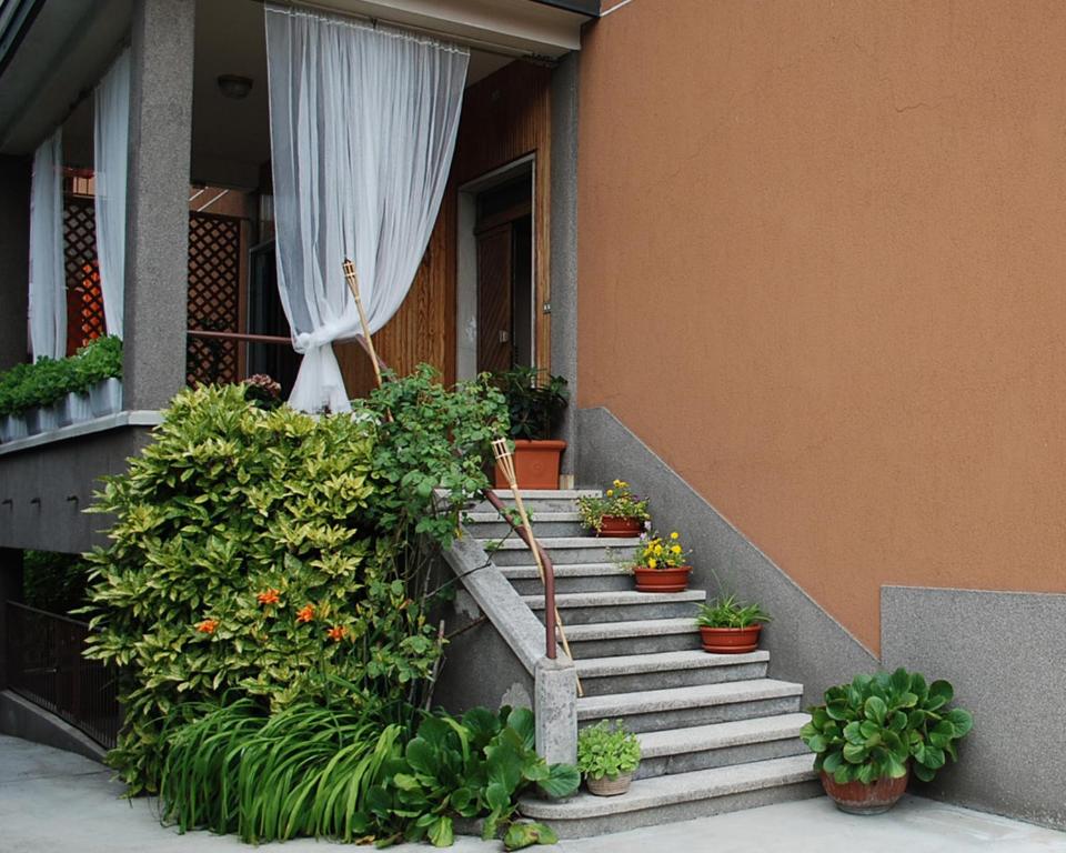 a set of stairs with potted plants on the side of a building at B&B D'Eco Milano in Milan