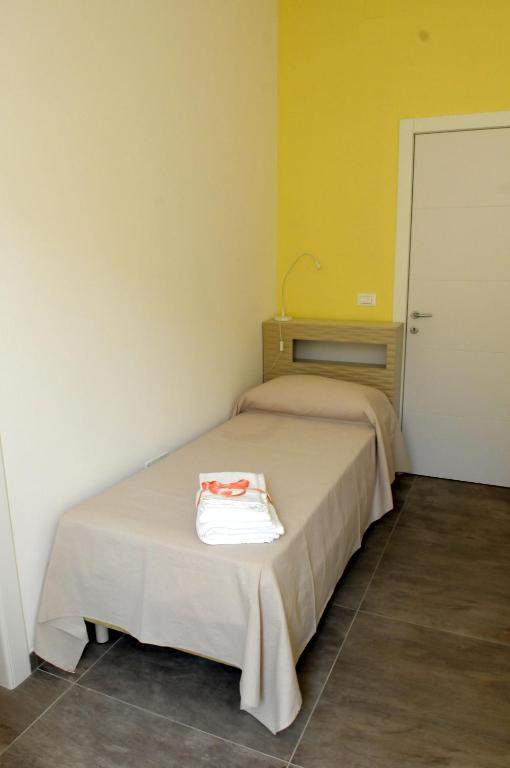 Postel nebo postele na pokoji v ubytování Della torre rooms