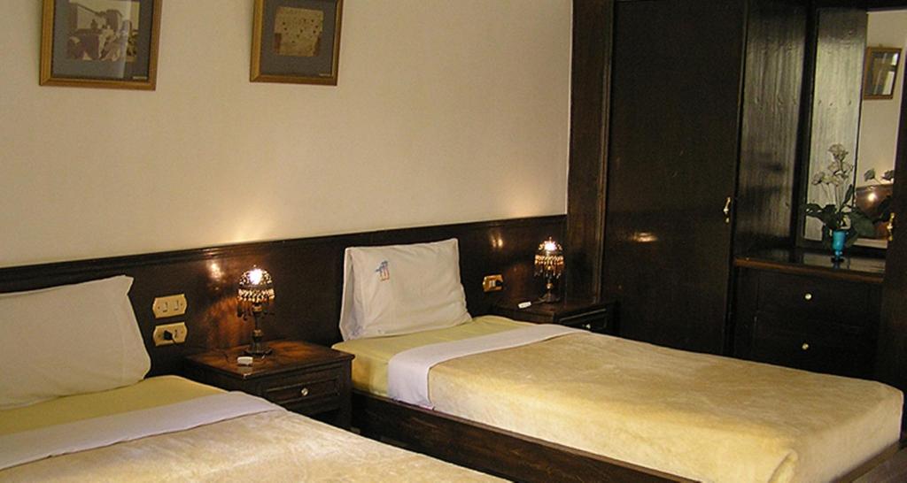 Postel nebo postele na pokoji v ubytování El Nakhil Hotel