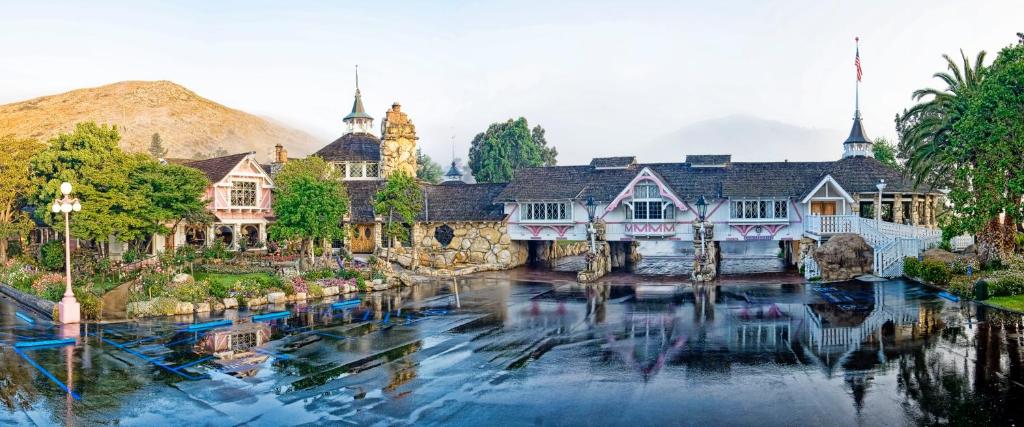 a house with a river in front of it at Madonna Inn in San Luis Obispo