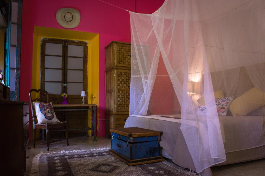 Postel nebo postele na pokoji v ubytování Casona Tlaquepaque Temazcal & Spa
