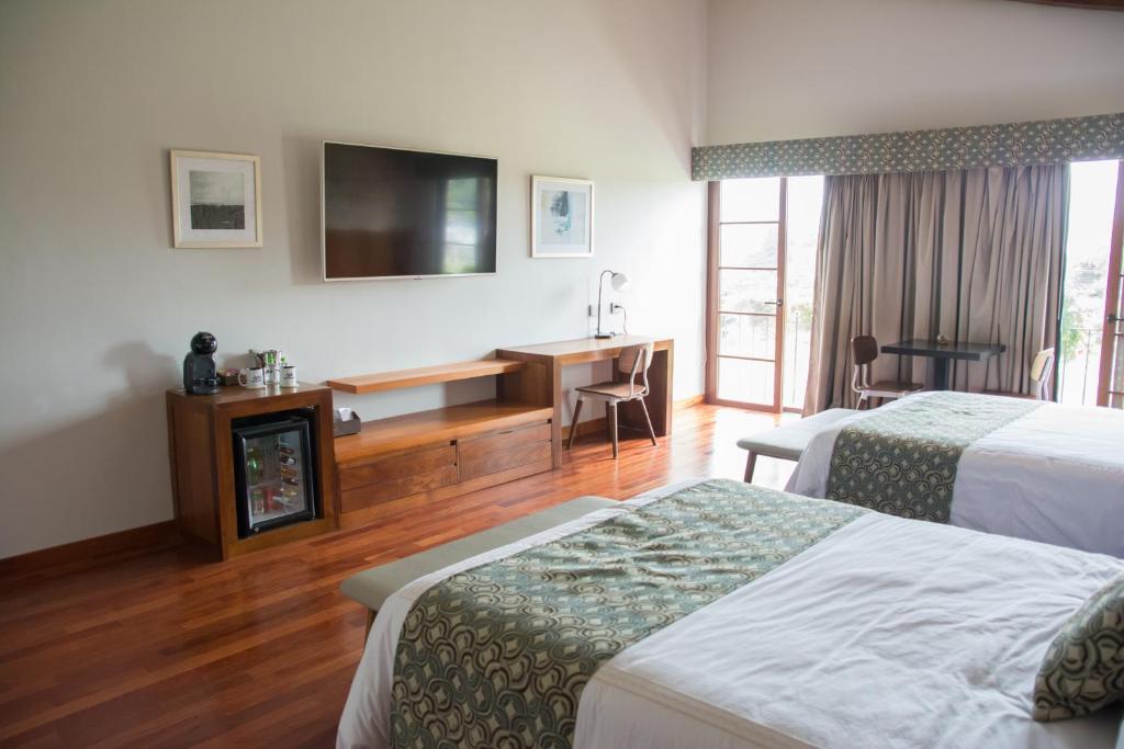 Postel nebo postele na pokoji v ubytování Los Brezos Hotel Boutique