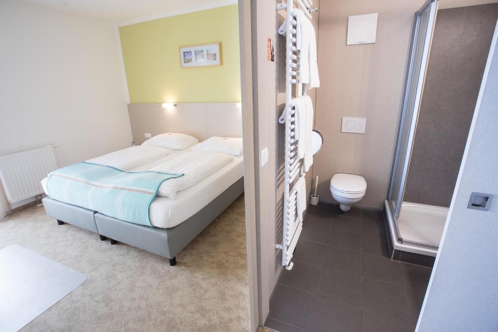 Posteľ alebo postele v izbe v ubytovaní motel22 Parkplatz inklusive