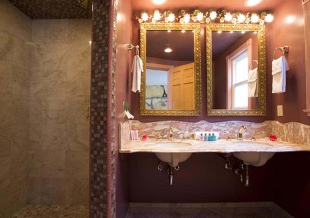 a bathroom with a sink and a mirror at Madonna Inn in San Luis Obispo